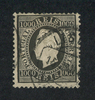 1884 - Afinsa nº 67. D. Luis I, fita direita. Nova cor e valor. Selo de 1000 reis usado. Denteado 12 1/2. Em boas condições.